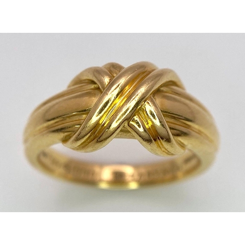 16 - A Beautiful Tiffany and Co. 18K Gold Love Ring. Tiffany and co. markings. Size N. 7.2g weight.