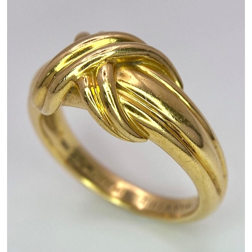 16 - A Beautiful Tiffany and Co. 18K Gold Love Ring. Tiffany and co. markings. Size N. 7.2g weight.