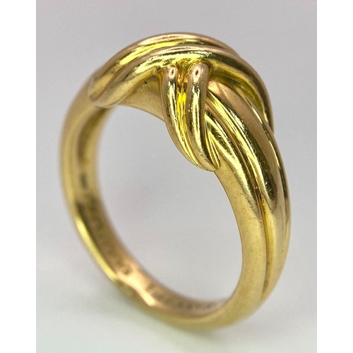 16 - A Beautiful Tiffany and Co. 18K Gold Love Ring. Tiffany and co. markings. Size N. 7.2g weight.