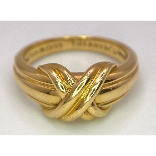 16 - A Beautiful Tiffany and Co. 18K Gold Love Ring. Tiffany and co. markings. Size N. 7.2g weight.