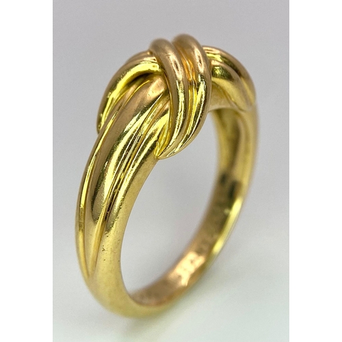 16 - A Beautiful Tiffany and Co. 18K Gold Love Ring. Tiffany and co. markings. Size N. 7.2g weight.