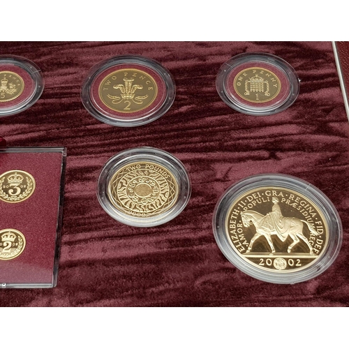 25 - A Breathtaking Limited Edition 2002 Golden Jubilee 22K Gold Proof Coin Set. This set contains a comp... 