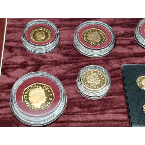 25 - A Breathtaking Limited Edition 2002 Golden Jubilee 22K Gold Proof Coin Set. This set contains a comp... 