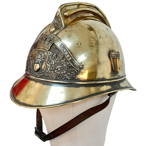 49 - A Late 19th Century French Fireman's Brass Ornate Helmet. 
With original liner.