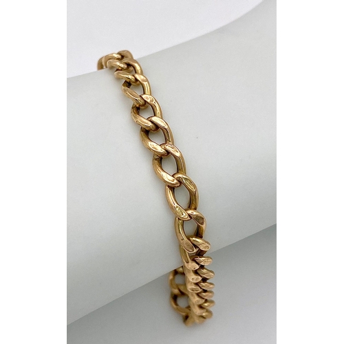 51 - An 18K Yellow Gold Flat Curb Link Bracelet. 19cm. 4.25g weight.