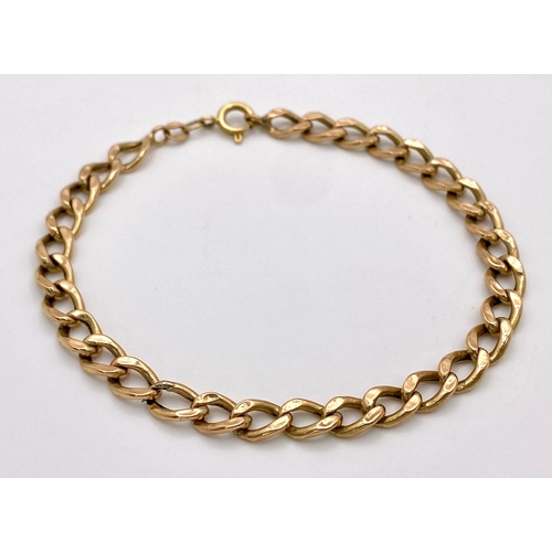 51 - An 18K Yellow Gold Flat Curb Link Bracelet. 19cm. 4.25g weight.