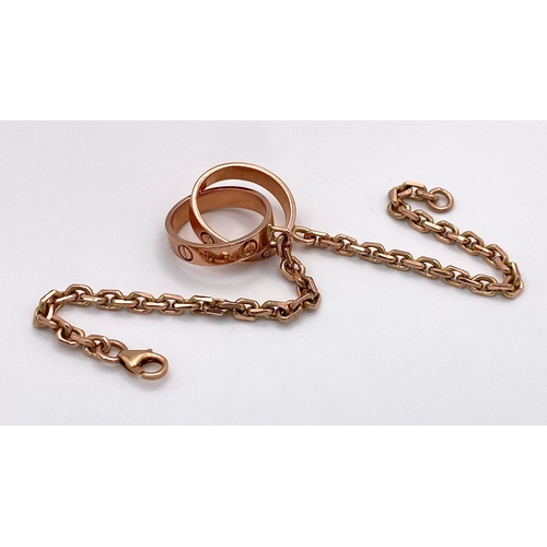 6 - A 9K Rose Gold Entwined Ring Bracelet. 18cm length. 10.7g weight.