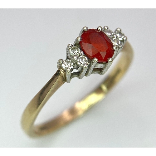 72 - A Vintage 9K Yellow Gold, Red Sapphire and Diamond Ring. Oval sapphire with diamond accents. Size O.... 