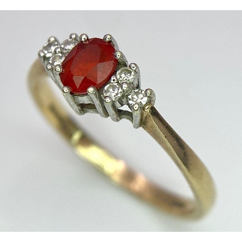 72 - A Vintage 9K Yellow Gold, Red Sapphire and Diamond Ring. Oval sapphire with diamond accents. Size O.... 