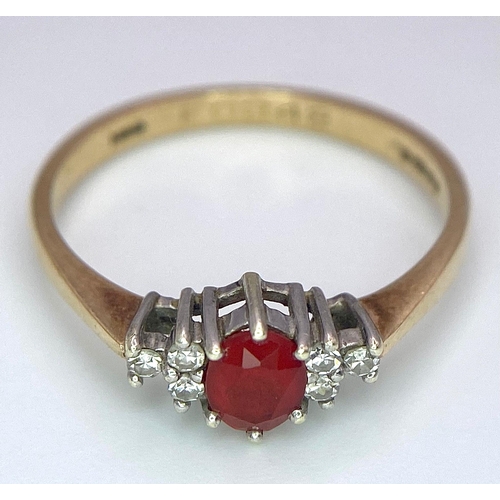 72 - A Vintage 9K Yellow Gold, Red Sapphire and Diamond Ring. Oval sapphire with diamond accents. Size O.... 