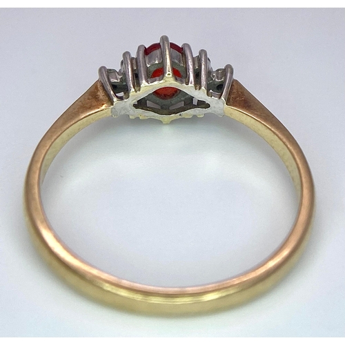 72 - A Vintage 9K Yellow Gold, Red Sapphire and Diamond Ring. Oval sapphire with diamond accents. Size O.... 