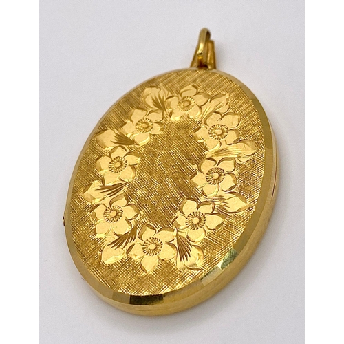 79 - A Large Vintage 9K Yellow Gold Locket Pendant. Classic floral decoration in an oval shape. 6cm. 16.4... 