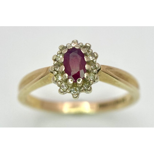 94 - A Vintage 9K Yellow Gold Diamond and Ruby Ring. Central oval diamond with diamond surround. Size L. ... 