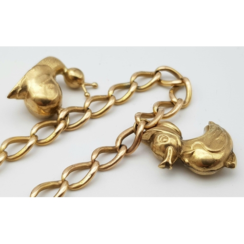 108 - A vintage 9 K rose gold chain bracelet with a padlock clasp and two chams (a snail and a duck). Good... 