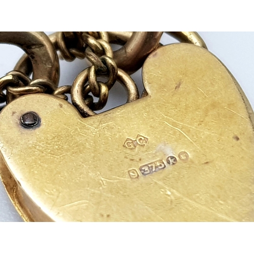 108 - A vintage 9 K rose gold chain bracelet with a padlock clasp and two chams (a snail and a duck). Good... 