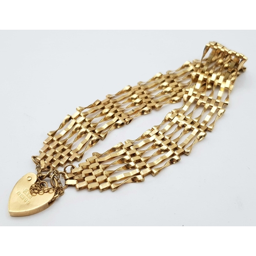 9 - A Vintage 9K Yellow Gold Gate Bracelet with Heart Clasp. 16cm. 6.82g weight.