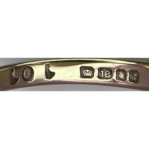 115 - An 18 K white gold ring with a cluster of diamonds and dark blue sapphires.  Size: M, weight: 4 g.