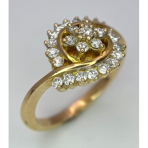 304 - An attractive 14K Yellow Gold (tested as) Diamond Swirl Ring, 0.55ct diamond weight, 4.6g total weig... 