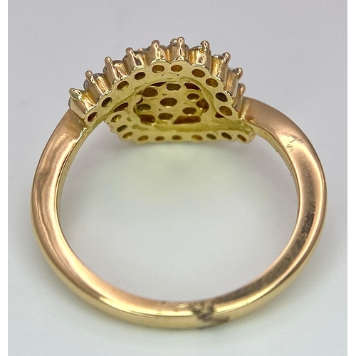 304 - An attractive 14K Yellow Gold (tested as) Diamond Swirl Ring, 0.55ct diamond weight, 4.6g total weig... 