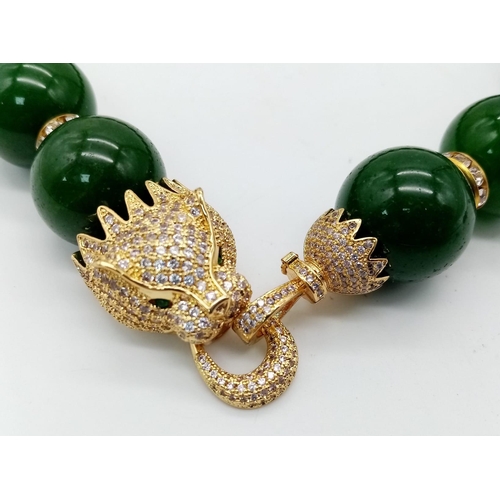 161 - An excellent quality, large beaded (20 mm diameter), spinach green jade necklace and earrings set wi... 