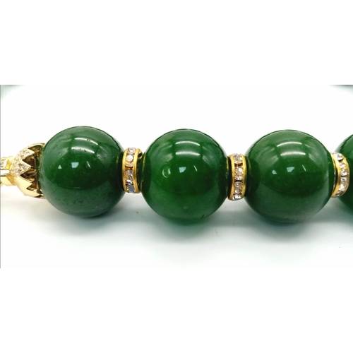 161 - An excellent quality, large beaded (20 mm diameter), spinach green jade necklace and earrings set wi... 