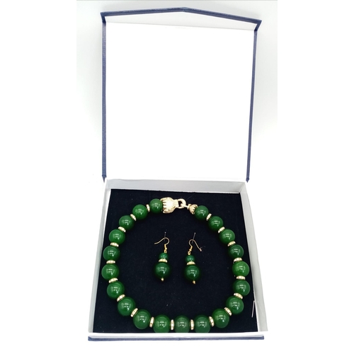 161 - An excellent quality, large beaded (20 mm diameter), spinach green jade necklace and earrings set wi... 