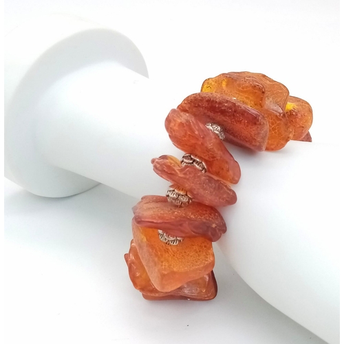 224 - An interesting bracelet consisting of large, 100% natural, cognac coloured, Baltic amber nuggets, in... 