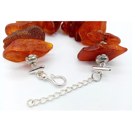 224 - An interesting bracelet consisting of large, 100% natural, cognac coloured, Baltic amber nuggets, in... 