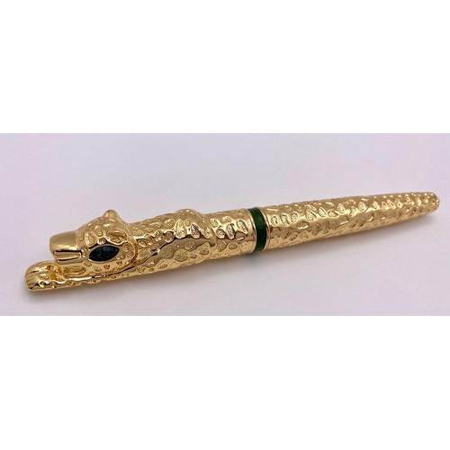 231 - A very substantial, designer style, pen in the shape of a panther with emerald-green eyes, in a pres... 