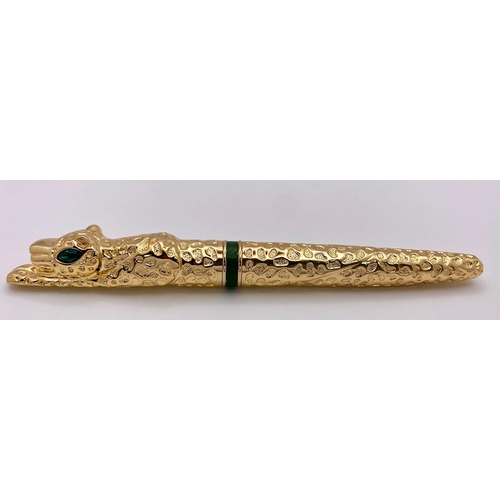 231 - A very substantial, designer style, pen in the shape of a panther with emerald-green eyes, in a pres... 