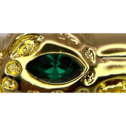 231 - A very substantial, designer style, pen in the shape of a panther with emerald-green eyes, in a pres... 