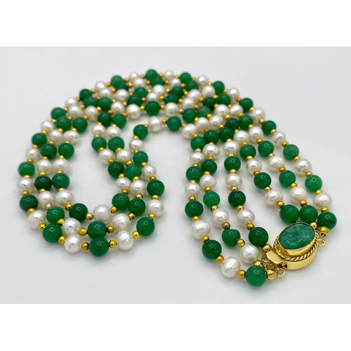 259 - A stunning, three row necklace of alternating green jade and natural white pearls from South Pacific... 