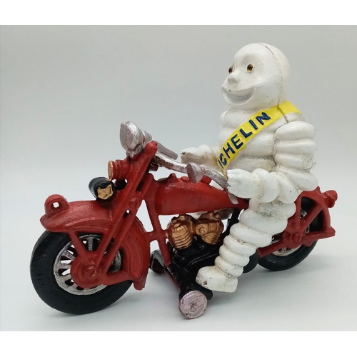 280 - A collector’s item, A vintage, French, cast iron smiling MITCHELIN MAN on a two-cylinder motorbike. ... 