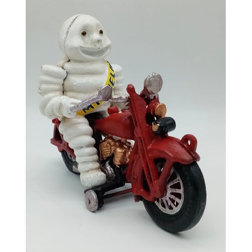 280 - A collector’s item, A vintage, French, cast iron smiling MITCHELIN MAN on a two-cylinder motorbike. ... 