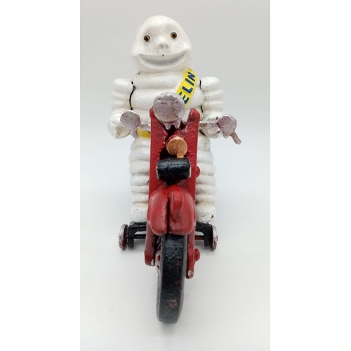 280 - A collector’s item, A vintage, French, cast iron smiling MITCHELIN MAN on a two-cylinder motorbike. ... 