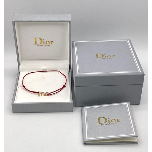 355 - A Christian Dior 18K Gold and Diamond 'Oui' Bracelet. Comes with original Dior packaging. Ref: 01663... 