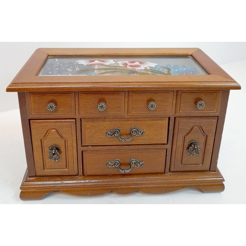 294 - A mini jewellery box with a selection of precious and semiprecious stone sets including lapis lazuli... 