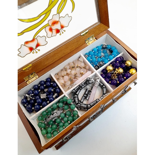 294 - A mini jewellery box with a selection of precious and semiprecious stone sets including lapis lazuli... 
