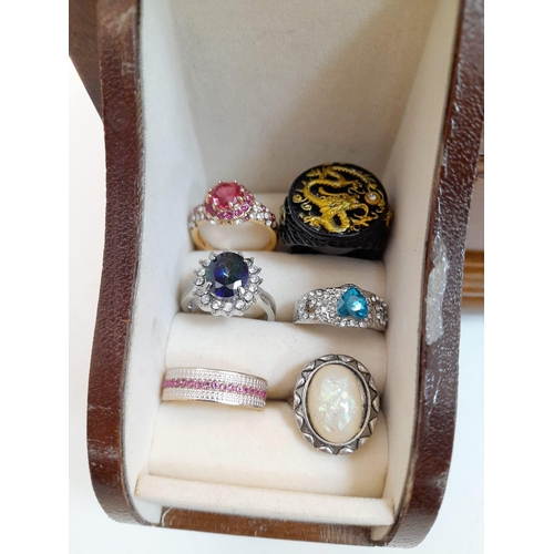 294 - A mini jewellery box with a selection of precious and semiprecious stone sets including lapis lazuli... 