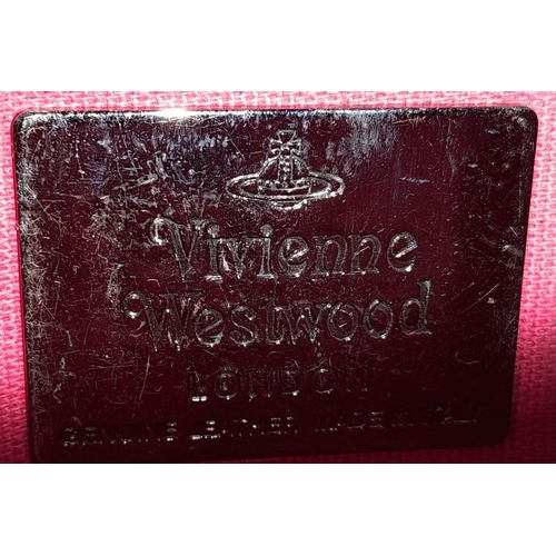 296 - A Vintage Vivienne Westwood Handbag. Brown leather and pony hair exterior. Key clasp. Red textile in... 