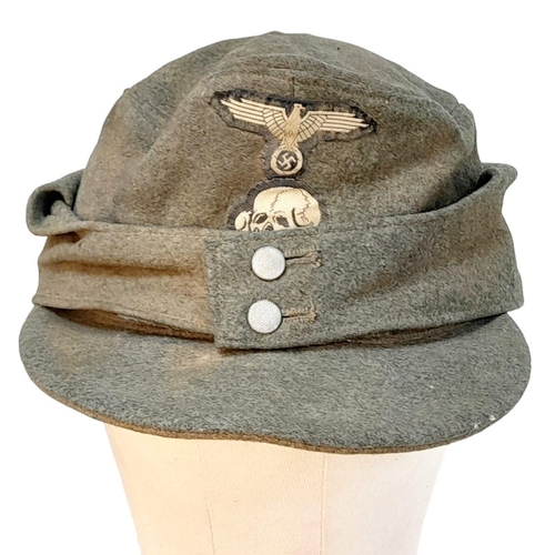 83 - 3rd Reich Waffen SS M43 Cap. very small cut on the top. A real “Been There” item.