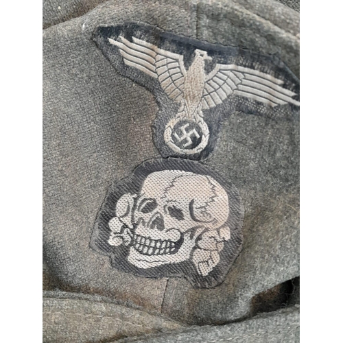 83 - 3rd Reich Waffen SS M43 Cap. very small cut on the top. A real “Been There” item.