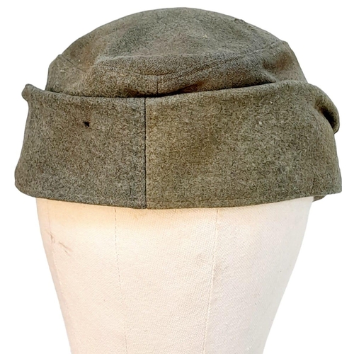 83 - 3rd Reich Waffen SS M43 Cap. very small cut on the top. A real “Been There” item.