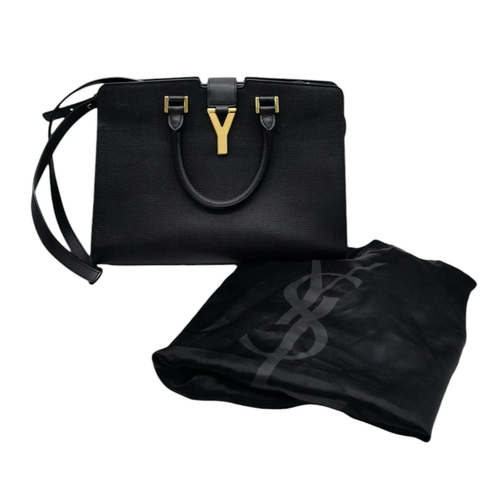 178 - An Yves Saint Laurent Black 'Cabas' Handbag. Leather exterior with gold-toned hardware, two rolled l... 