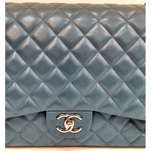 18 - A Chanel Teal Jumbo Classic Double Flap Bag. Quilted leather exterior with silver-toned hardware, ch... 