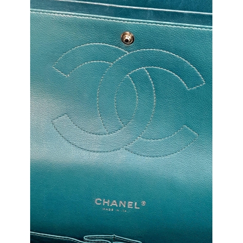 18 - A Chanel Teal Jumbo Classic Double Flap Bag. Quilted leather exterior with silver-toned hardware, ch... 