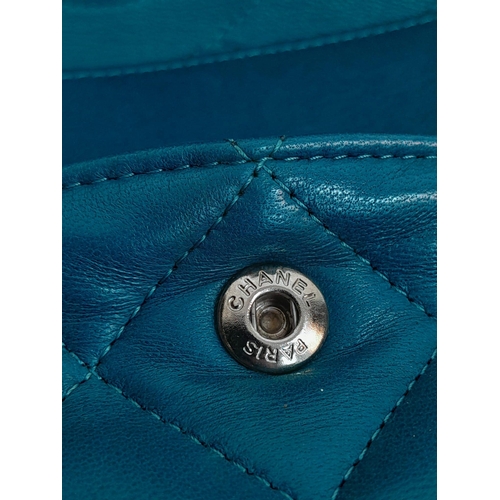 18 - A Chanel Teal Jumbo Classic Double Flap Bag. Quilted leather exterior with silver-toned hardware, ch... 