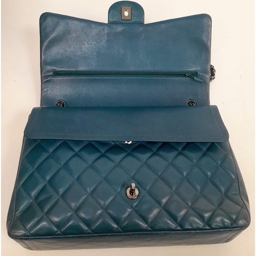 18 - A Chanel Teal Jumbo Classic Double Flap Bag. Quilted leather exterior with silver-toned hardware, ch... 