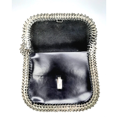 326 - A Paco Rabanne Black 69 Chain Bag. Leather exterior with silver-toned perforated steel discs linked ... 