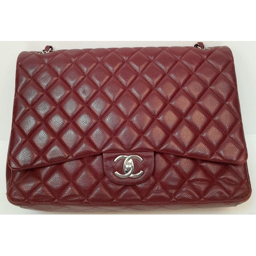 39 - A Chanel Burgundy Jumbo Classic Double Flap Bag. Quilted leather exterior with silver-toned hardware... 